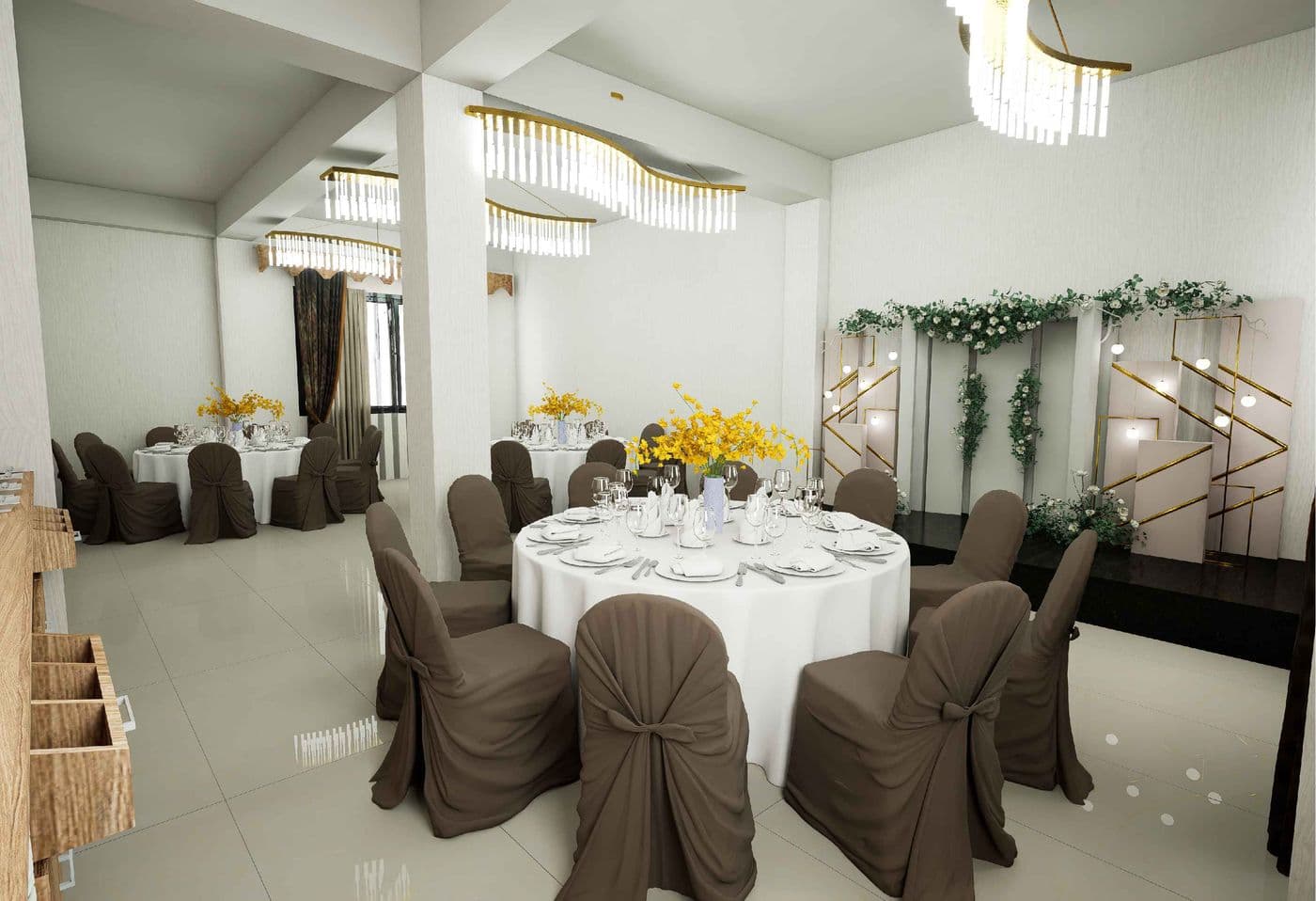 Event hall set for a wedding reception with chandelier lighting and banquet seating